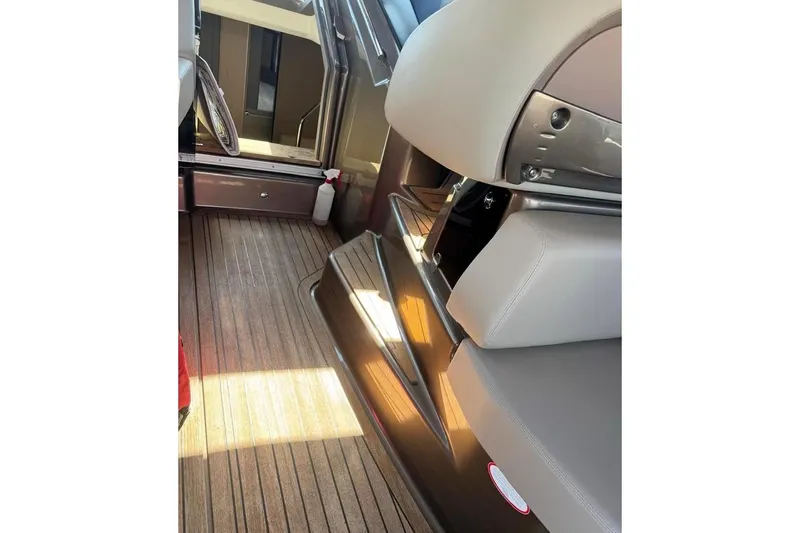 Yacht Photos Pics Interior of 2019 Cranchi M 44 HT yacht with wooden flooring and modern seating.