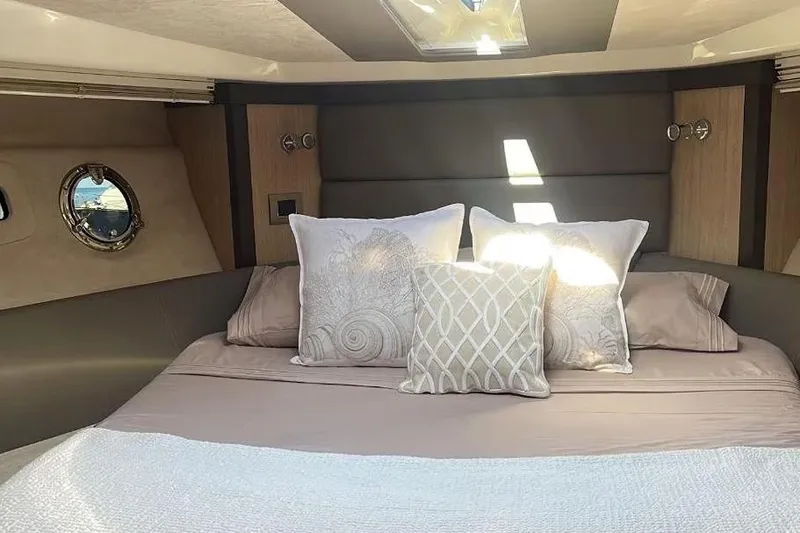  Yacht Photos Pics Luxurious cabin interior of 2019 Cranchi M 44 HT yacht with elegant bedding.