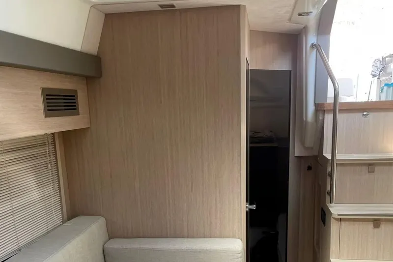  Yacht Photos Pics Interior of 2019 Cranchi M 44 HT yacht, featuring modern wood paneling and sleek design.