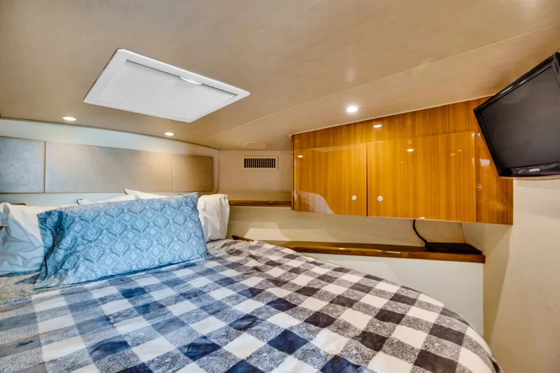  Yacht Photos Pics Interior of 2011 Viking 42 Open with bed and TV.