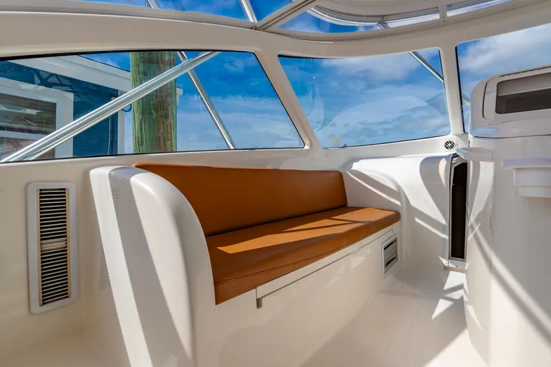  Yacht Photos Pics Interior of a 2011 Viking 42 Open yacht with brown seating.