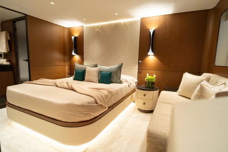  Yacht Photos Pics Luxurious bedroom interior in 2025 Extra X90 Fast yacht, featuring elegant lighting and modern design.