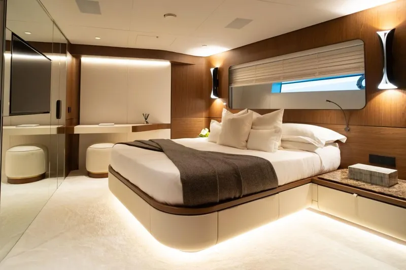  Yacht Photos Pics Luxurious bedroom interior in 2025 Extra X90 Fast yacht, featuring modern design and ambient lighting.