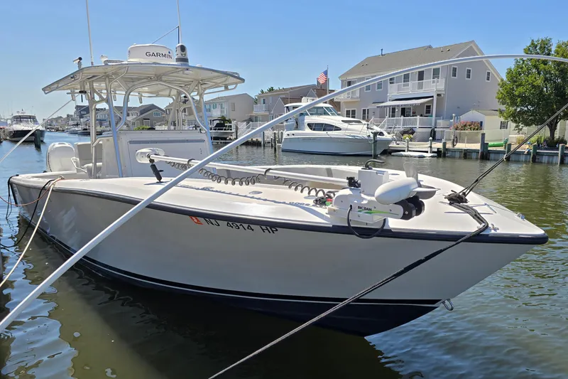  Yacht Photos Pics 2004 SeaVee 340B boat docked in a residential marina, sunny day.