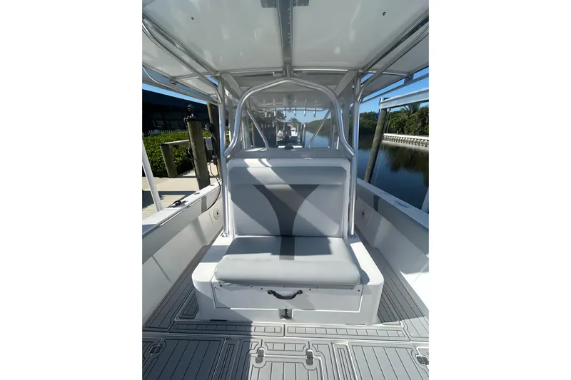  Yacht Photos Pics 2004 SeaVee 340B boat interior with cushioned seating and sleek design.