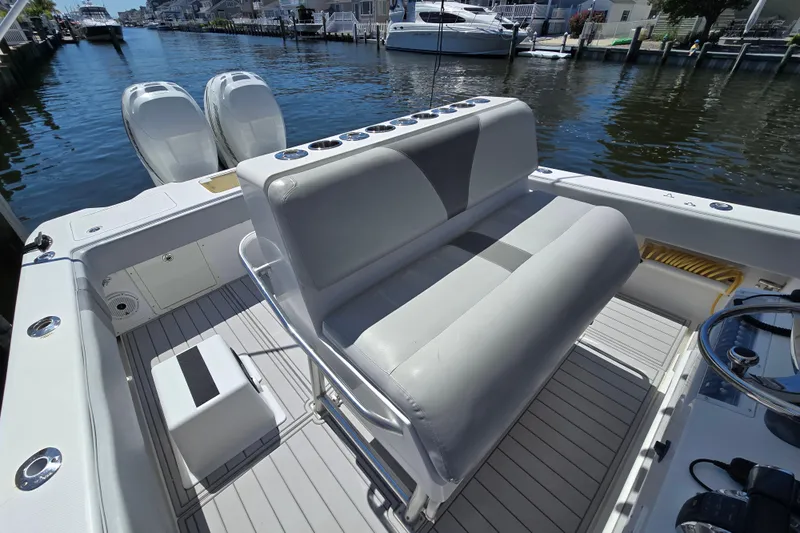  Yacht Photos Pics 2004 SeaVee 340B boat interior with dual engines, docked in a marina.