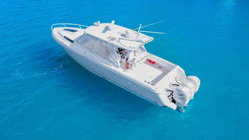  Yacht Photos Pics 2012 Intrepid 400 Cuddy boat on clear blue water.