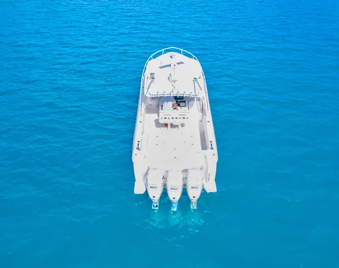  Yacht Photos Pics Intrepid 400 Cuddy 2012 boat on clear blue water, aerial view.