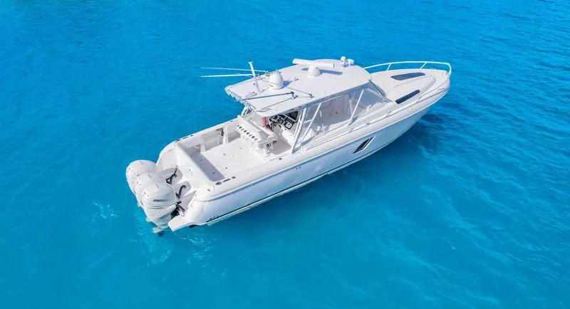  Yacht Photos Pics 2012 Intrepid 400 Cuddy boat on clear blue water.