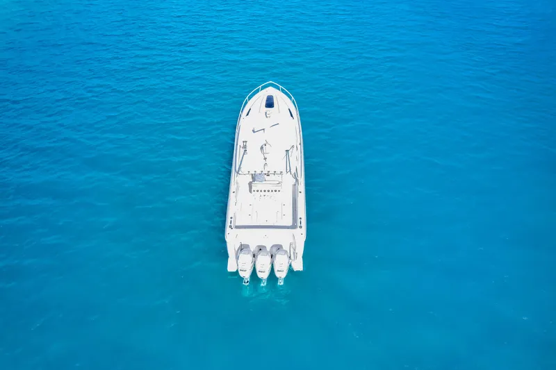  Yacht Photos Pics Aerial view of 2012 Intrepid 400 Cuddy boat on clear blue water.