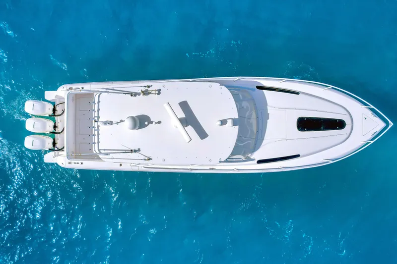  Yacht Photos Pics Aerial view of 2012 Intrepid 400 Cuddy boat on clear blue water.