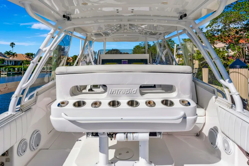  Yacht Photos Pics 2012 Intrepid 400 Cuddy boat interior with seating and cup holders.