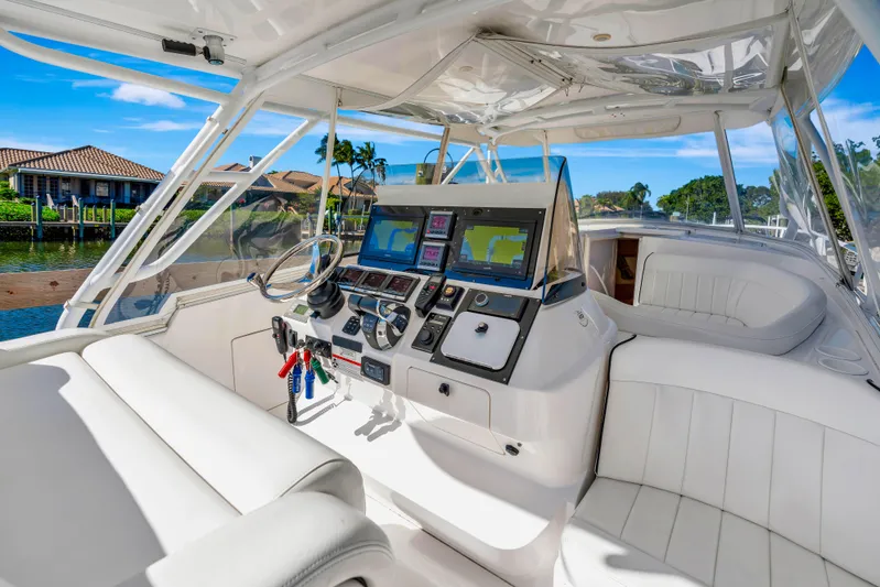  Yacht Photos Pics Luxurious 2012 Intrepid 400 Cuddy boat interior with advanced navigation systems and plush seating.