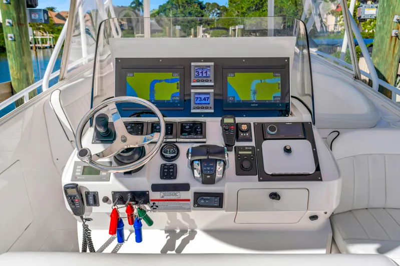  Yacht Photos Pics Intrepid 400 Cuddy 2012 boat dashboard with navigation screens and controls.