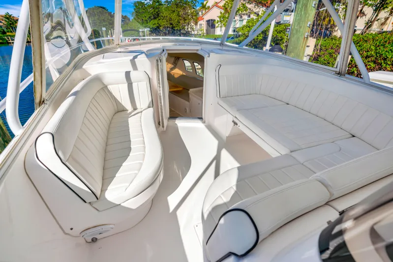  Yacht Photos Pics 2012 Intrepid 400 Cuddy boat interior with white seating and open cabin.