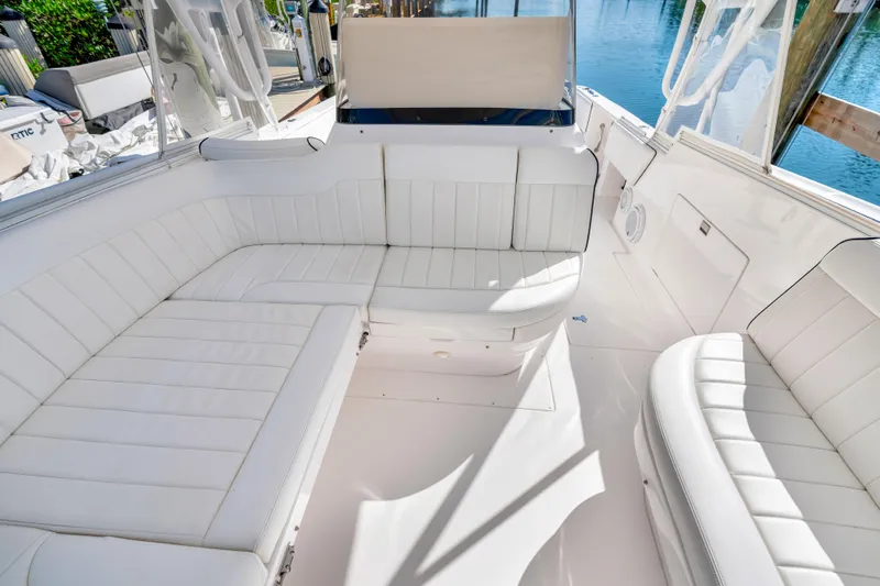  Yacht Photos Pics 2012 Intrepid 400 Cuddy boat with white cushioned seating and clear water view.