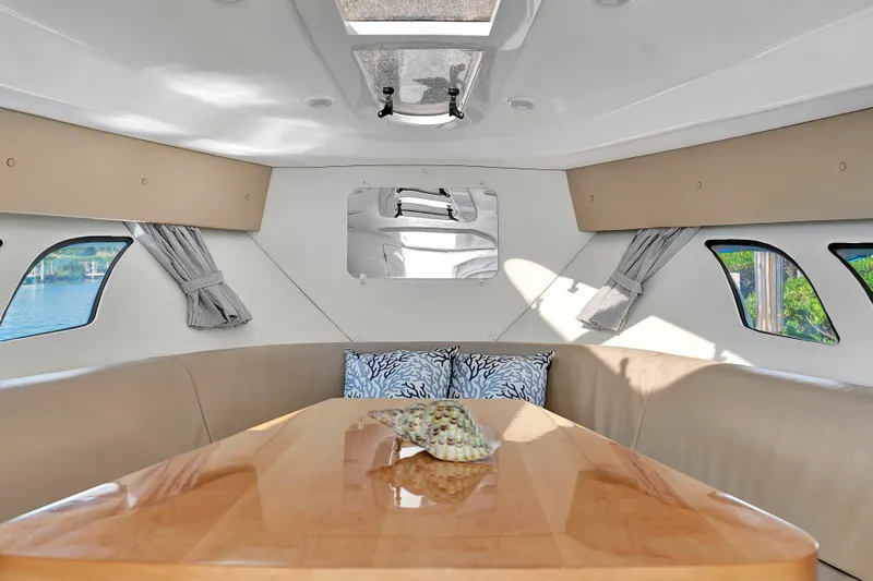  Yacht Photos Pics Interior of 2012 Intrepid 400 Cuddy boat with cozy seating and elegant table.