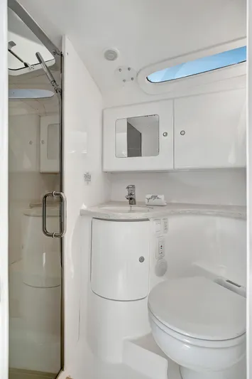  Yacht Photos Pics 2012 Intrepid 400 Cuddy bathroom with modern fixtures and sleek design.