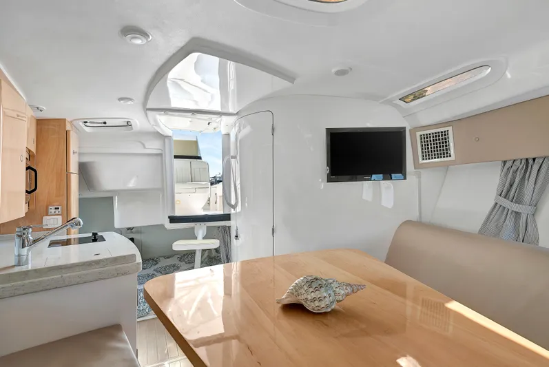  Yacht Photos Pics Interior of 2012 Intrepid 400 Cuddy boat with modern kitchen and dining area.