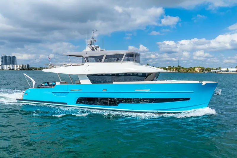 Lady Sadie Yacht Photos Pics Van der Valk LeVen 90 yacht cruising on blue waters under a partly cloudy sky.