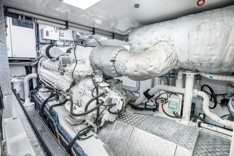 Lady Sadie Yacht Photos Pics Engine room of 2019 Van der Valk LeVen 90 yacht, showcasing machinery and piping.