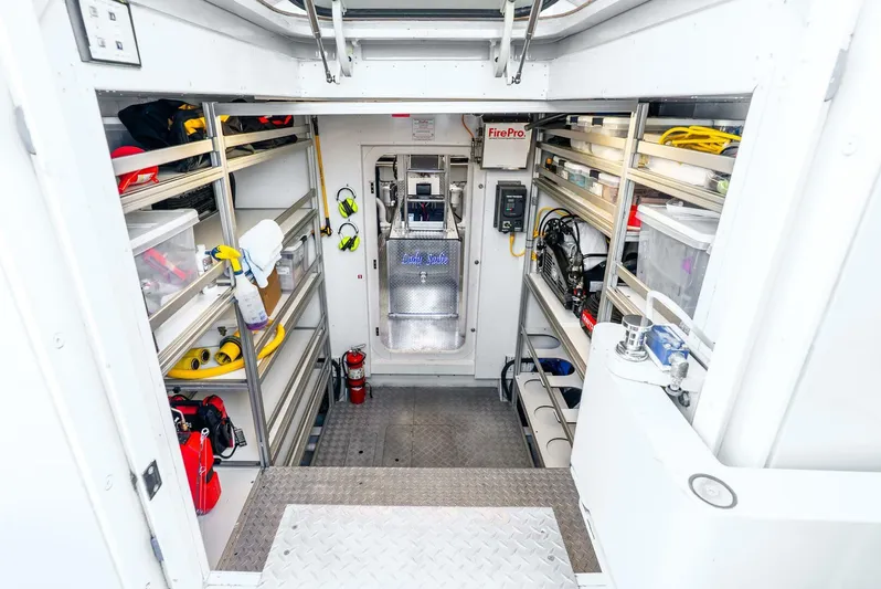Lady Sadie Yacht Photos Pics Engine room of 2019 Van der Valk LeVen 90 yacht, featuring organized storage and equipment.