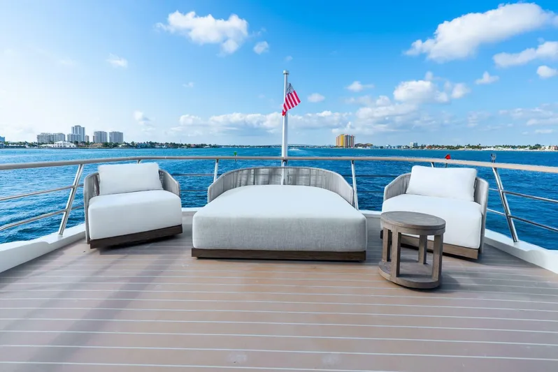 Lady Sadie Yacht Photos Pics Luxurious deck of 2019 Van der Valk LeVen 90 yacht with seating, ocean view, and blue sky.