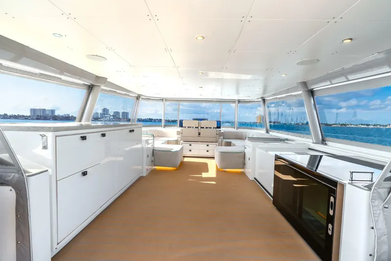 Lady Sadie Yacht Photos Pics Luxurious interior of 2019 Van der Valk LeVen 90 yacht with panoramic windows and modern amenities.