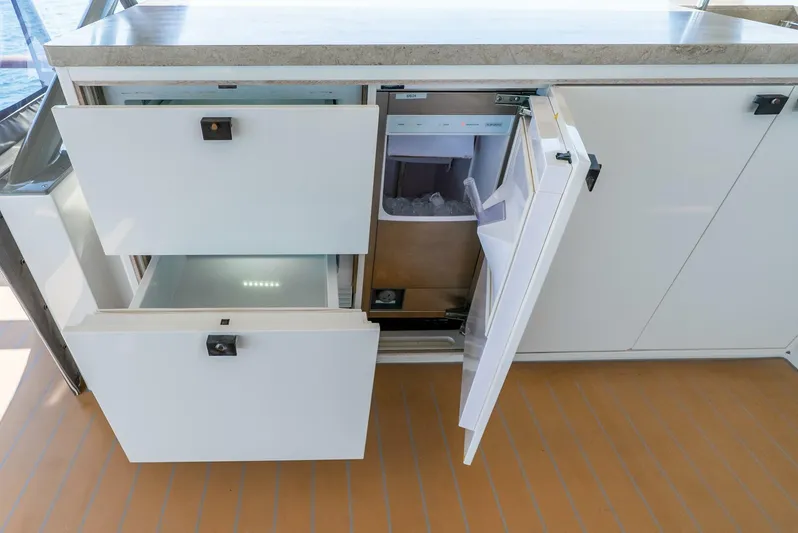 Lady Sadie Yacht Photos Pics Open storage drawers and cabinet on 2019 Van der Valk LeVen 90 yacht.