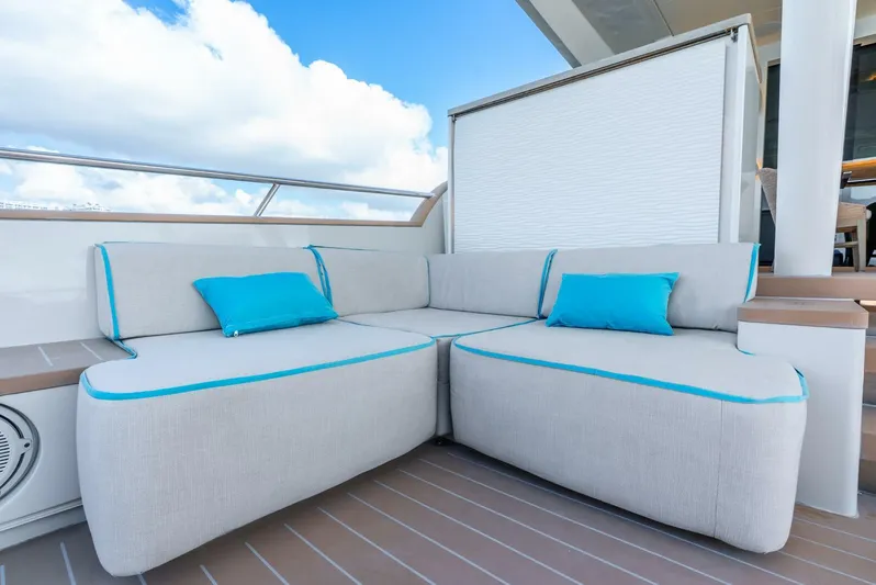 Lady Sadie Yacht Photos Pics Luxurious seating area on 2019 Van der Valk LeVen 90 yacht with blue-accented cushions.