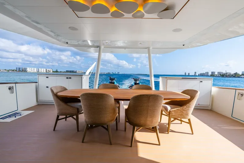 Lady Sadie Yacht Photos Pics Luxurious Van der Valk LeVen 90 yacht deck with dining area, ocean view, and modern design.