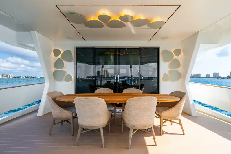 Lady Sadie Yacht Photos Pics Luxurious dining area on 2019 Van der Valk LeVen 90 yacht, featuring elegant seating and ocean views.