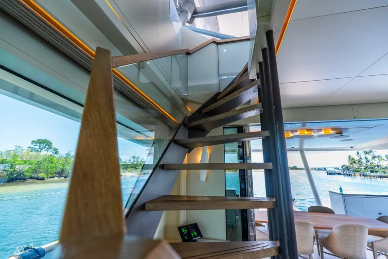 Lady Sadie Yacht Photos Pics Luxurious interior of 2019 Van der Valk LeVen 90 yacht with modern staircase and scenic views.