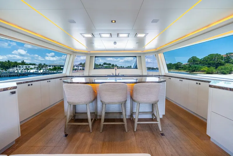 Lady Sadie Yacht Photos Pics Luxurious interior of 2019 Van der Valk LeVen 90 yacht with panoramic windows and elegant seating.
