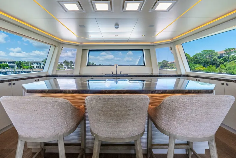 Lady Sadie Yacht Photos Pics Luxurious interior of 2019 Van der Valk LeVen 90 yacht with panoramic windows and elegant seating.