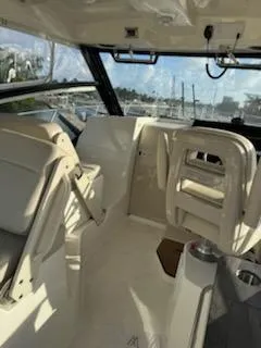  Yacht Photos Pics Interior of 2023 Boston Whaler 325 Conquest boat with seating and helm.