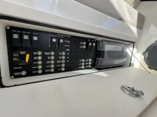  Yacht Photos Pics Control panel of 2023 Boston Whaler 325 Conquest boat, featuring various switches and buttons.