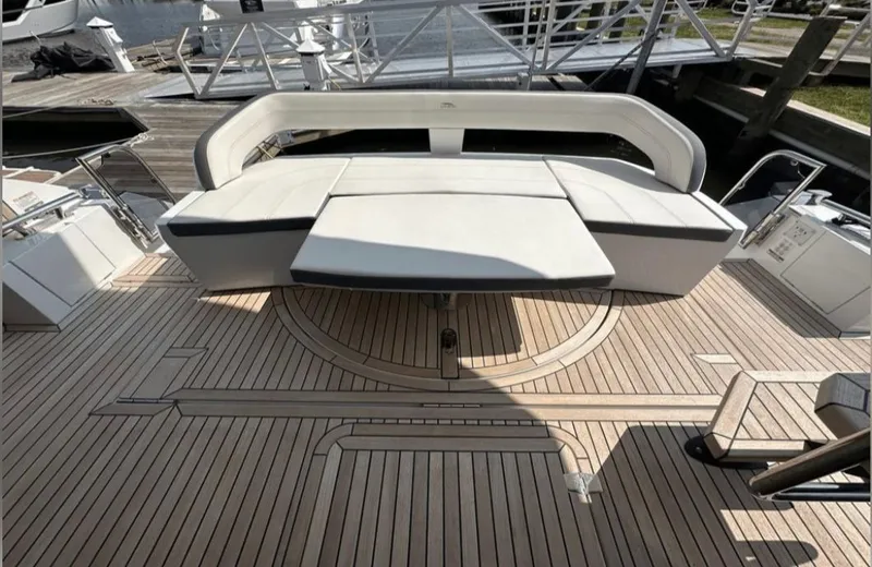 The Good Life Yacht Photos Pics Galeon 510 Sky 2024 with elegant wood deck and luxurious seating.