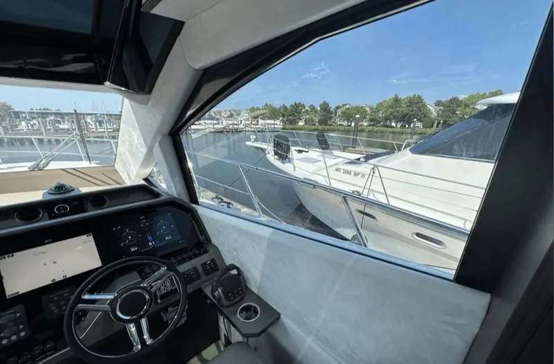 The Good Life Yacht Photos Pics Interior view of 2024 Galeon 510 Sky yacht overlooking marina.