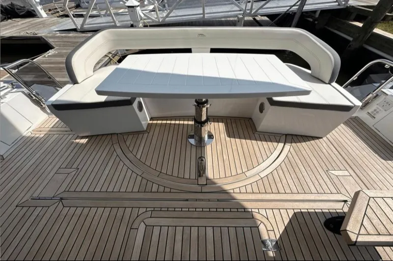 The Good Life Yacht Photos Pics Galeon 510 Sky 2024: Elegant deck seating with wooden flooring.
