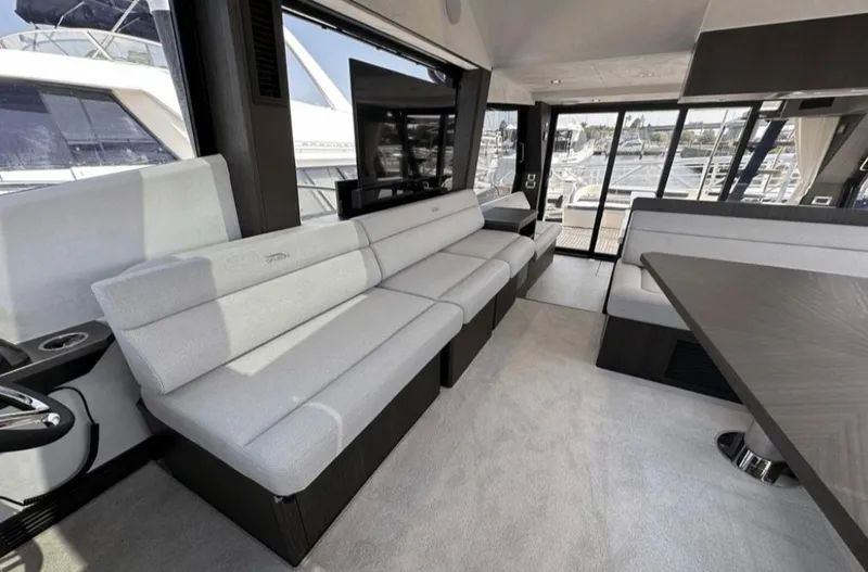 The Good Life Yacht Photos Pics Interior of 2024 Galeon 510 Sky yacht with sleek seating area.