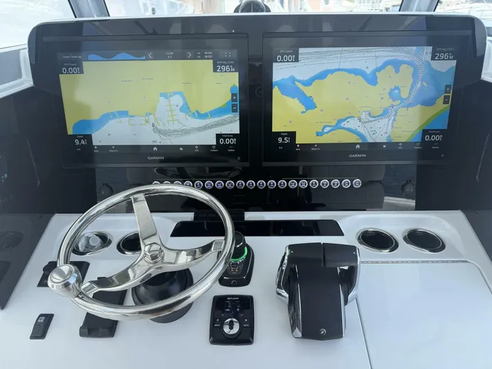  Yacht Photos Pics Freeman 38 boat dashboard with dual Garmin displays and steering wheel, 2026 model.