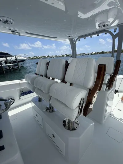  Yacht Photos Pics Luxurious seating on a 2026 Freeman 38 boat, overlooking a serene waterfront.