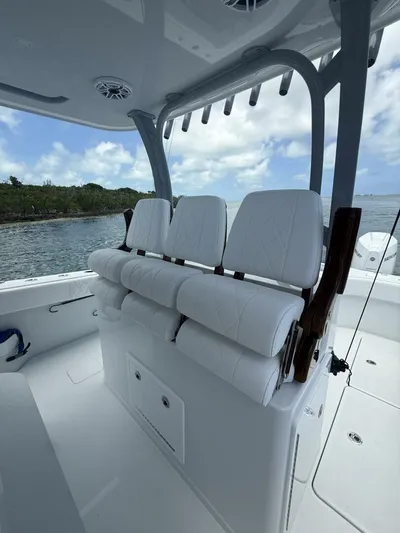  Yacht Photos Pics Luxury seating on a 2026 Freeman 38 boat, featuring white cushioned seats and sleek design.
