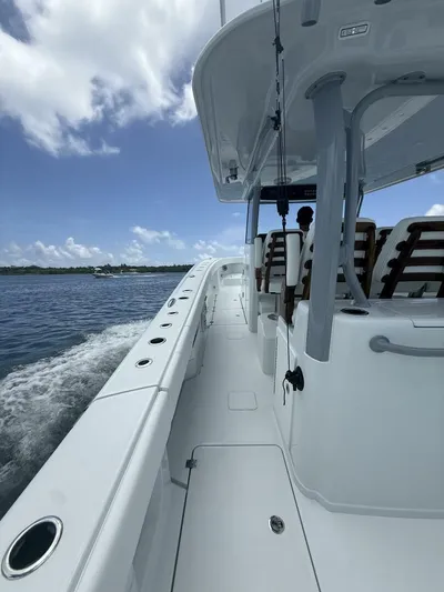  Yacht Photos Pics 2026 Freeman 38 boat cruising on open water under a clear blue sky.