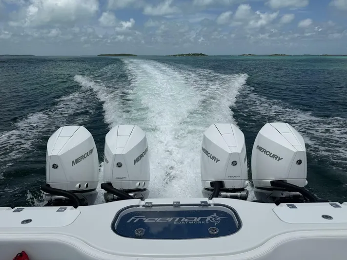  Yacht Photos Pics Freeman 38 boat with four Mercury engines cruising on open water, 2026 model.