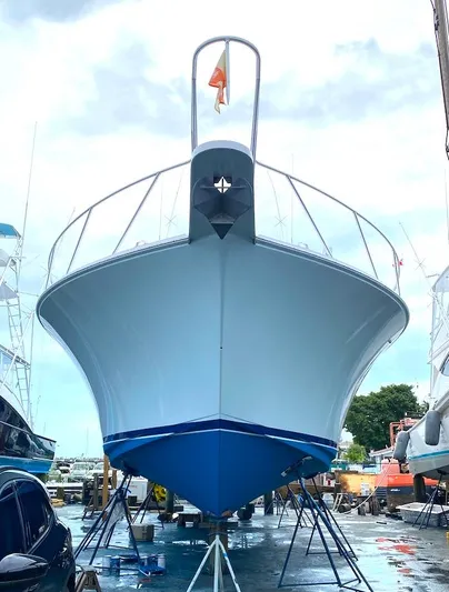  Yacht Photos Pics 1999 Viking Boats Convertible on stands, viewed from the front in a boatyard.