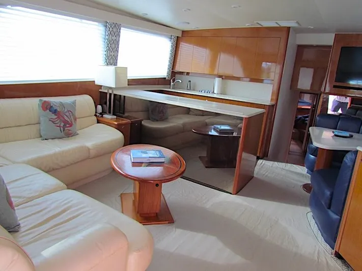  Yacht Photos Pics Luxurious interior of a 1999 Viking Convertible boat with elegant seating and modern amenities.