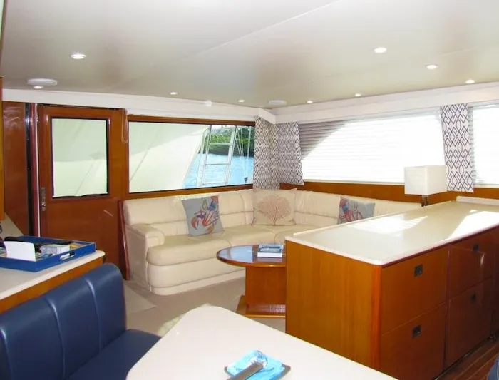  Yacht Photos Pics Luxurious interior of a 1999 Viking Convertible boat with elegant seating and decor.