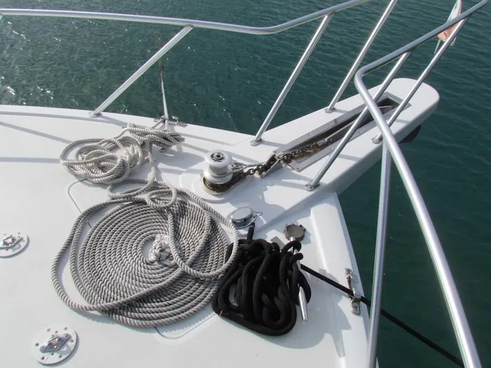  Yacht Photos Pics Bow of 1999 Viking Boats Convertible with ropes and anchor chain on deck.